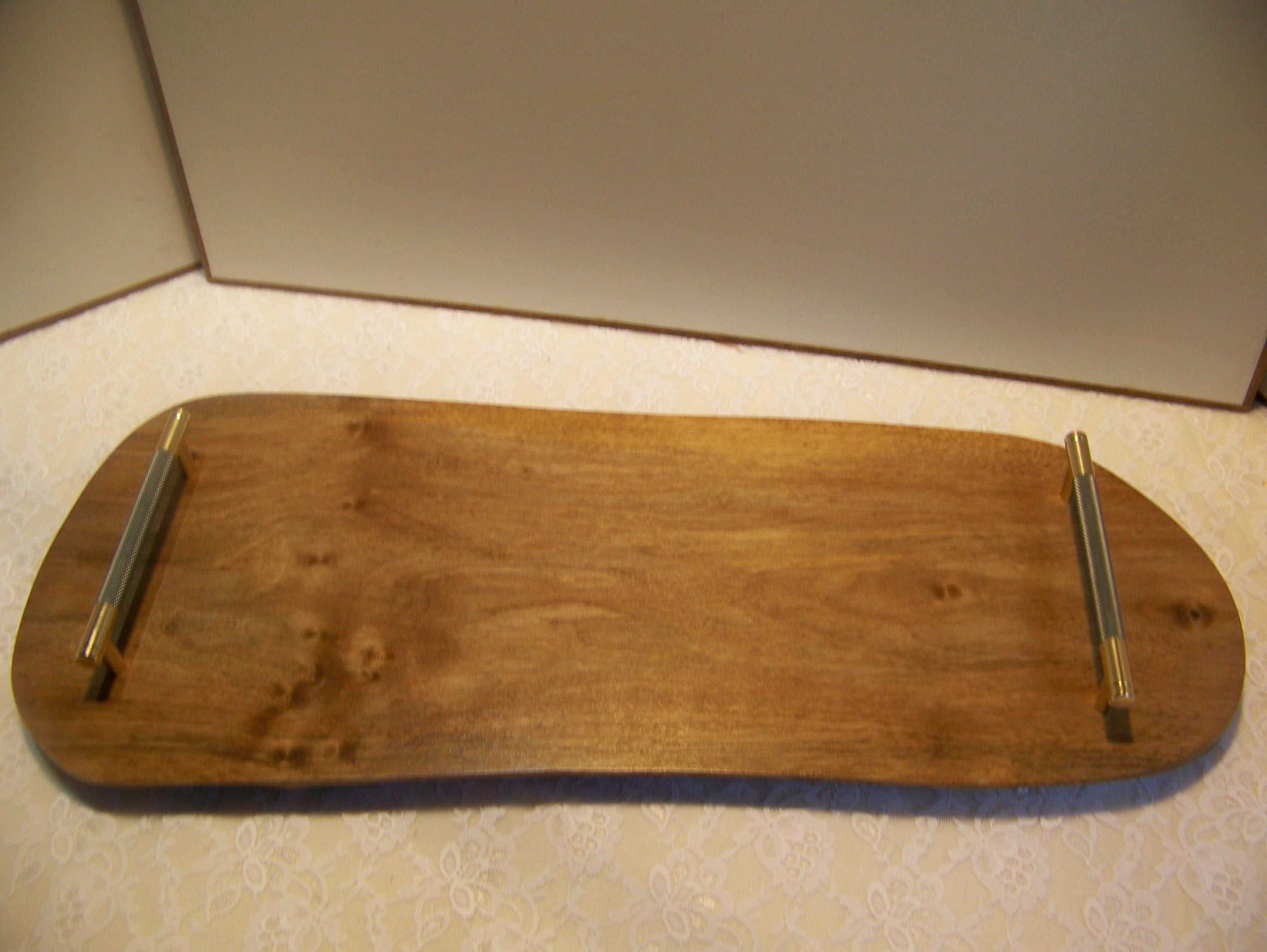 Live Edge Walnut Charcuterie Board with Brass/gray knurled handles.