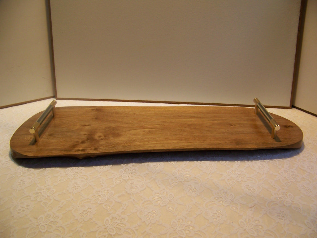 Live Edge Walnut Charcuterie Board with Brass/gray knurled handles.