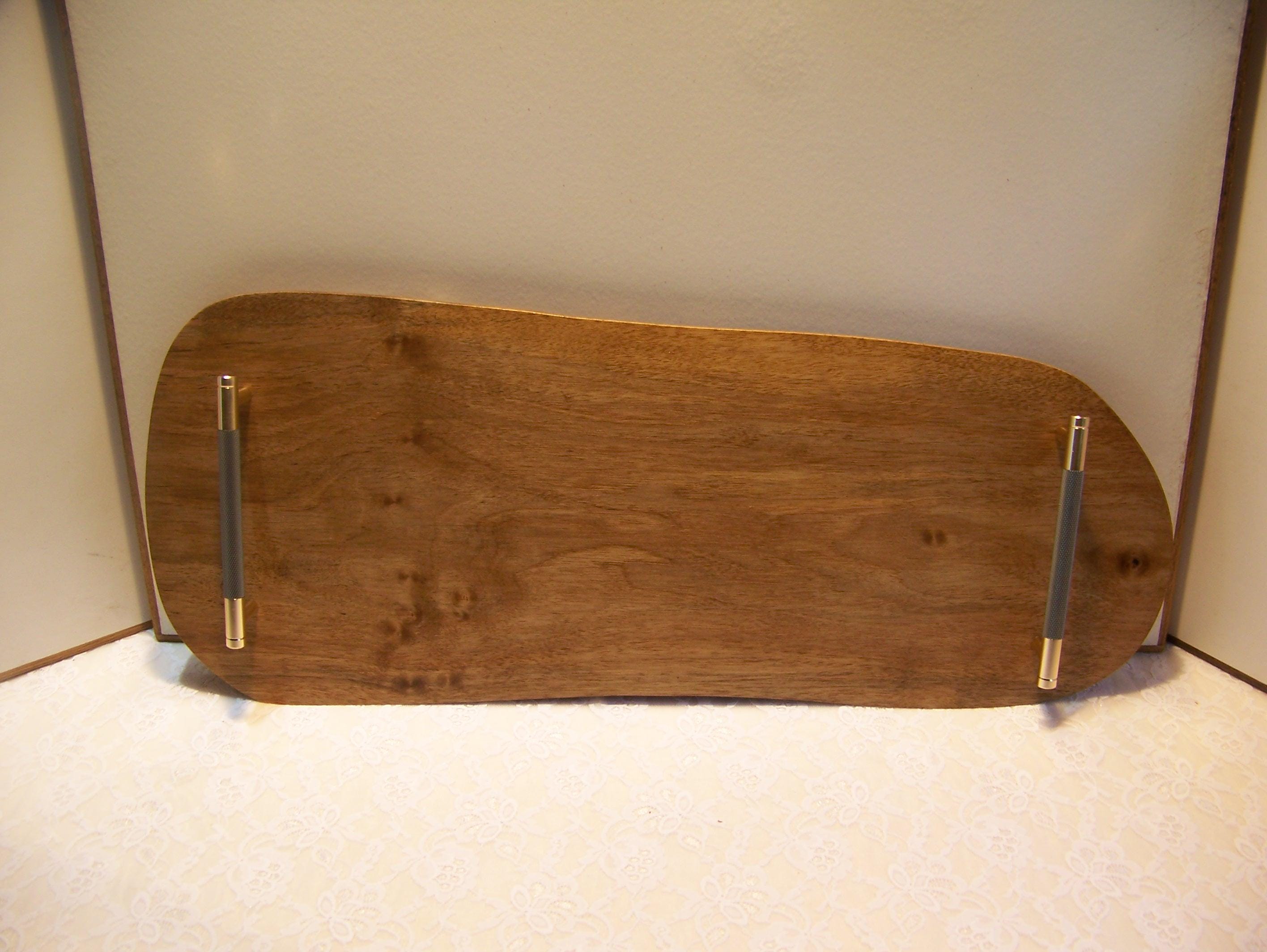 Live Edge Walnut Charcuterie Board with Brass/gray knurled handles.