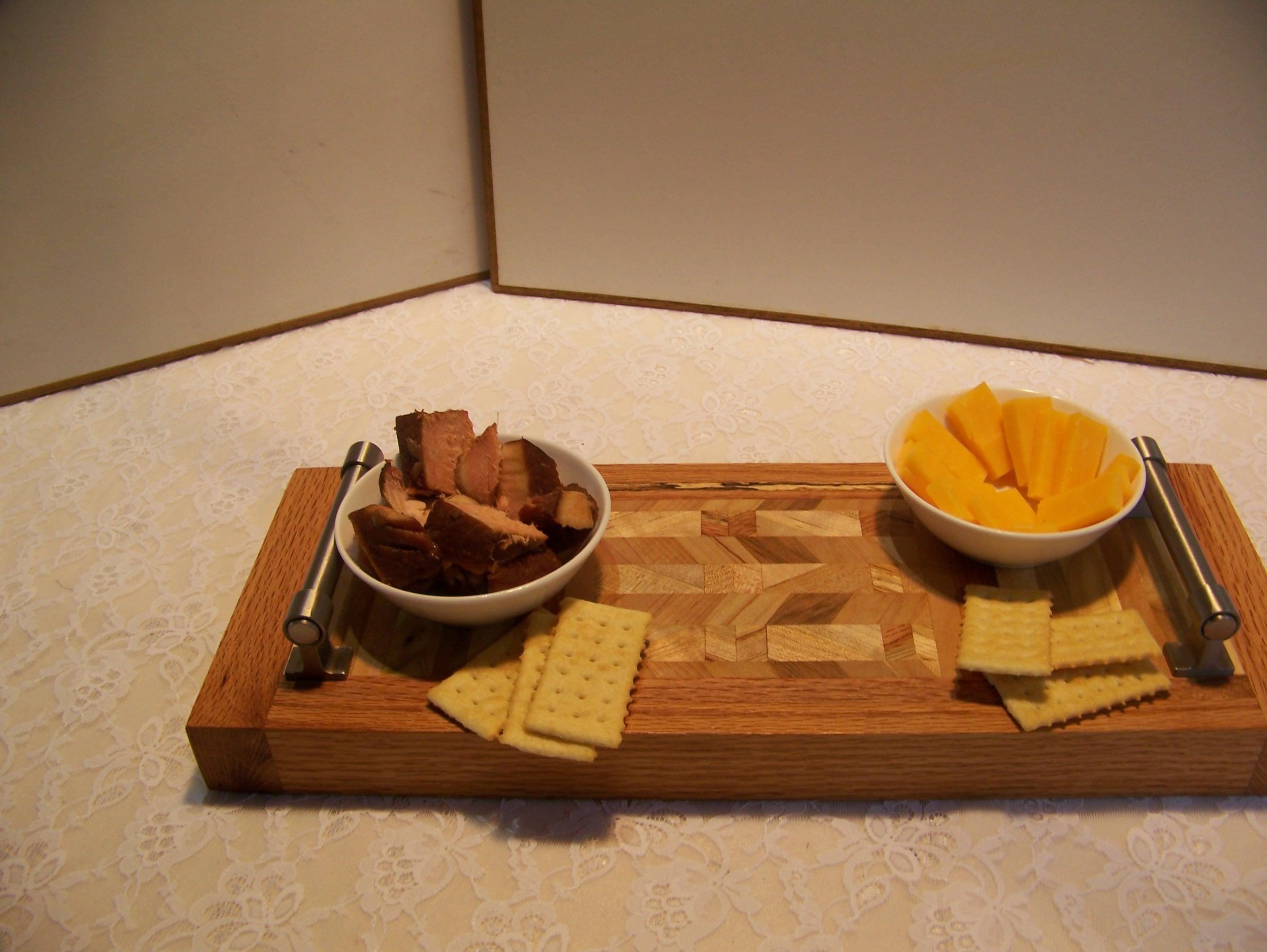 Cheese Board made with multiple hardwoods, brushed nickel handles