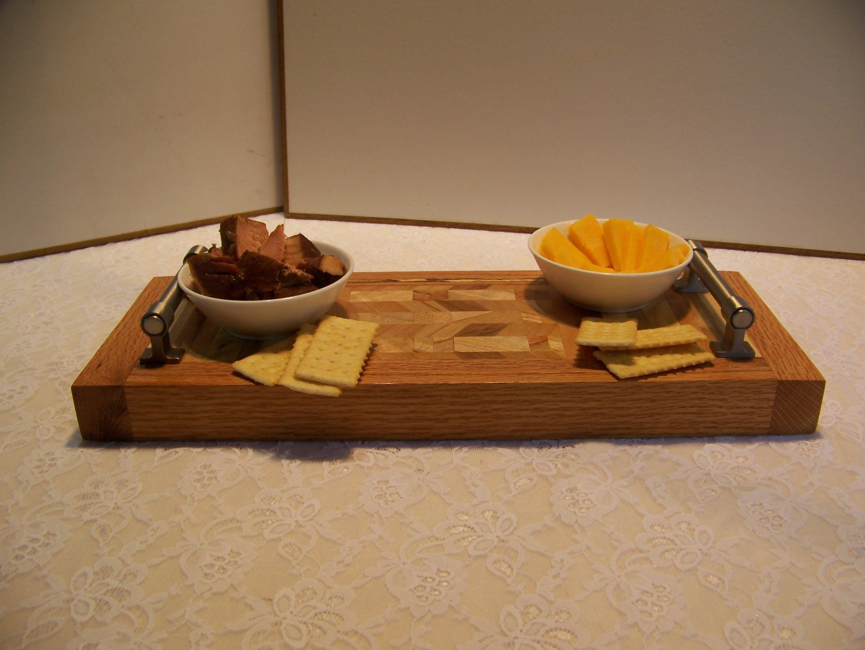 Cheese Board made with multiple hardwoods, brushed nickel handles