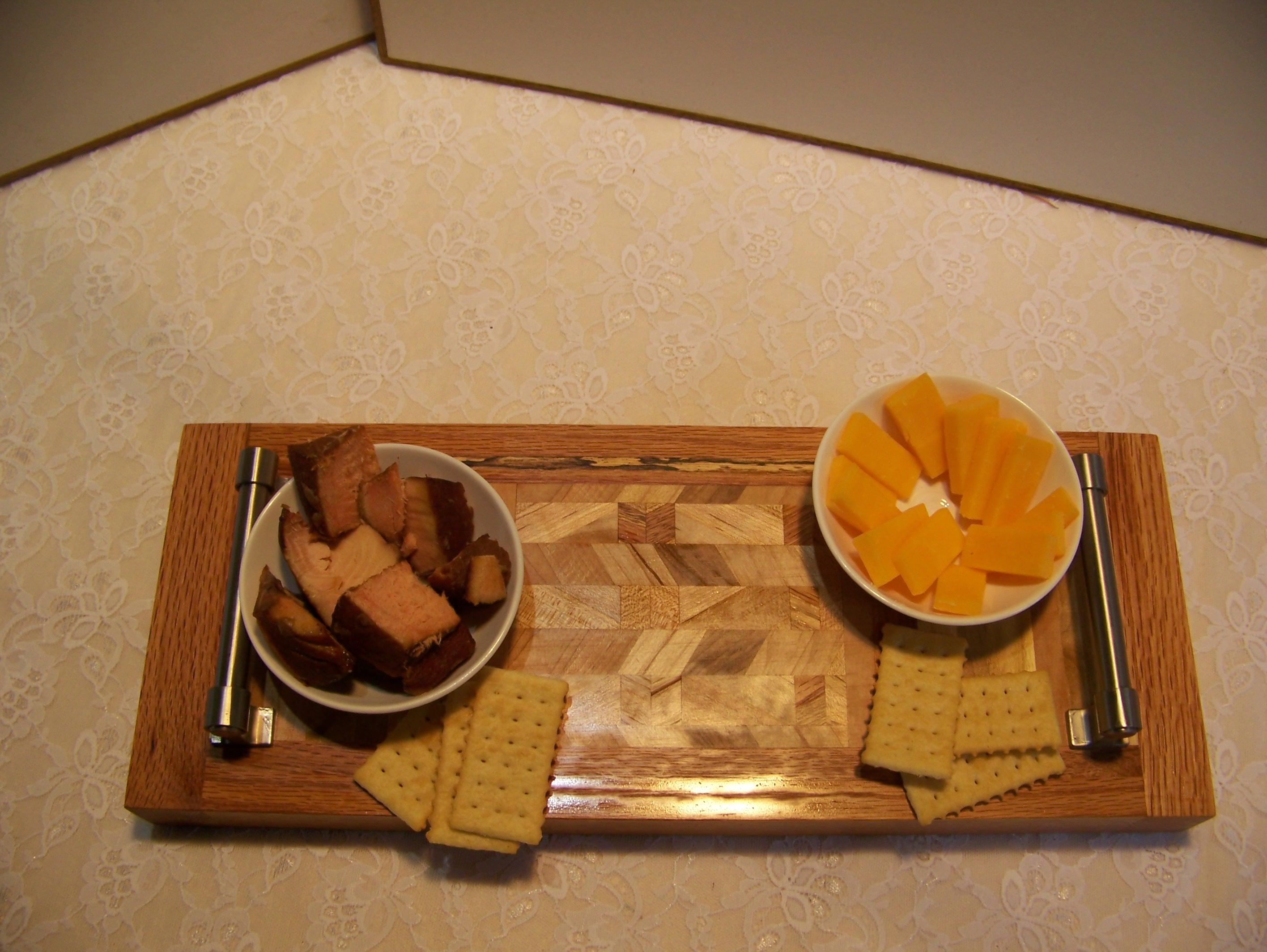Cheese Board made with multiple hardwoods, brushed nickel handles