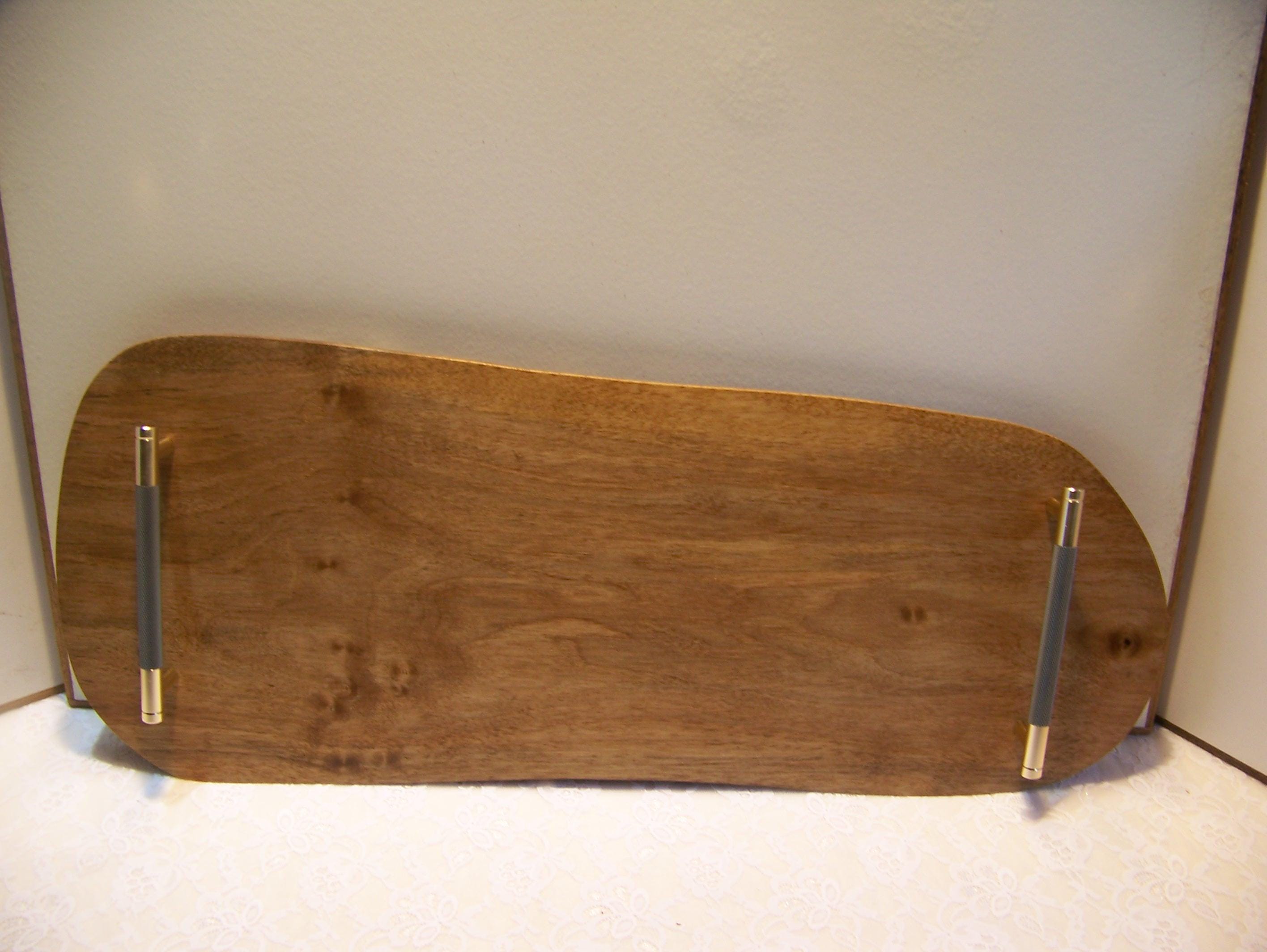 Live Edge Walnut Charcuterie Board with Brass/gray knurled handles.