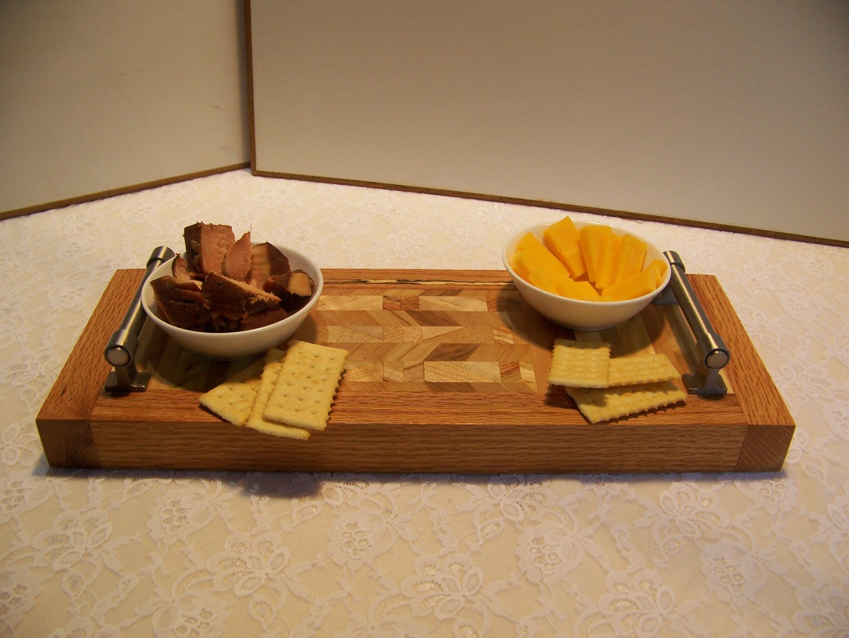 Cheese Board made with multiple hardwoods, brushed nickel handles