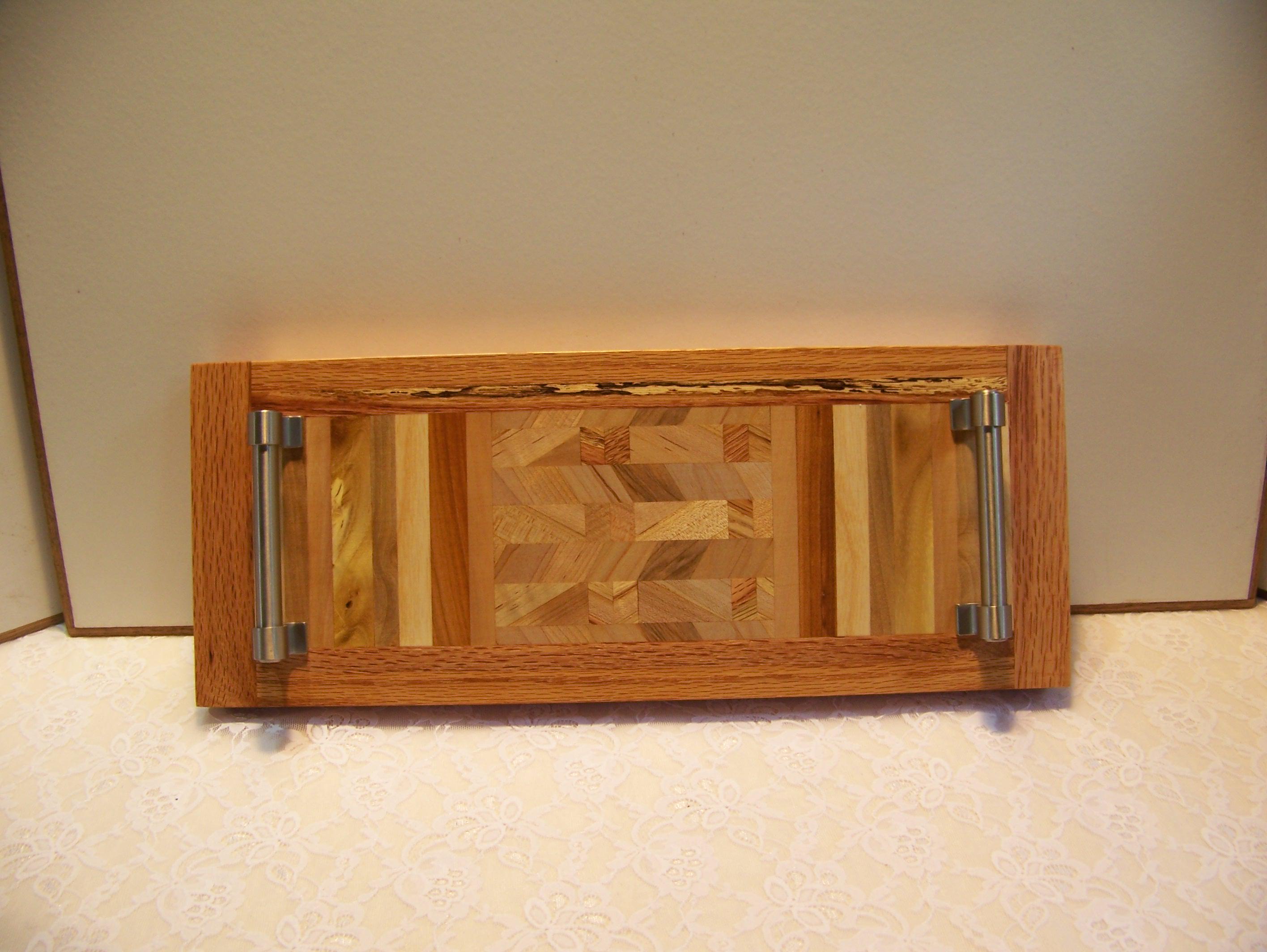 Cheese Board made with multiple hardwoods, brushed nickel handles