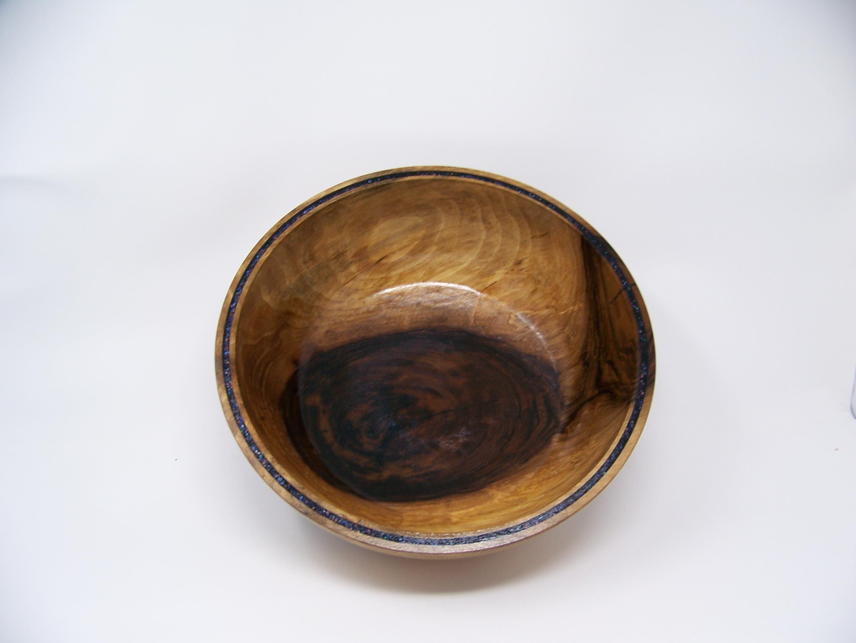 Black Walnut bowl with double row of epoxy glitter around rim